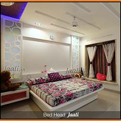 Contemporary master bedroom bed head Jaali cut out of Solid Surface (Corian)